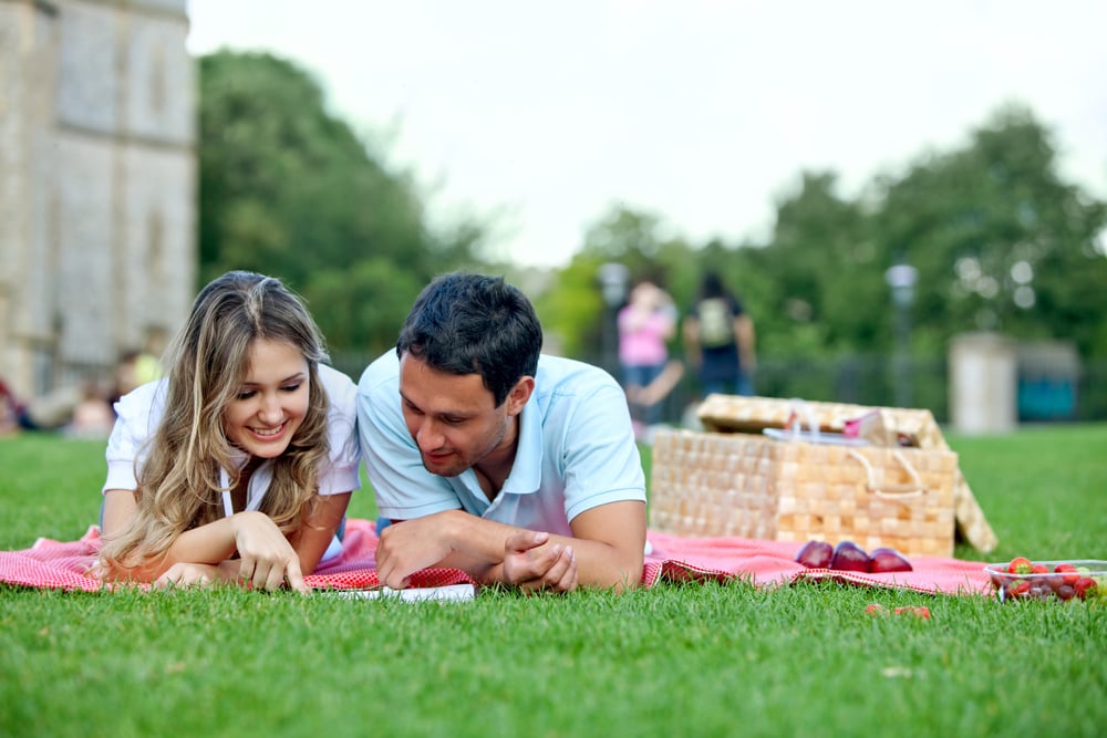 Young loving couple having a picnic outdoors